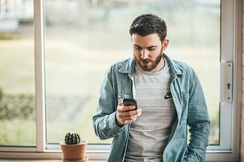 best-seo-strategies-for-small-businesses-man-using-mobile-clio-websites