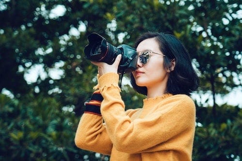 best-website-builders-for-photographers-clio-website-header-woman-with-camera