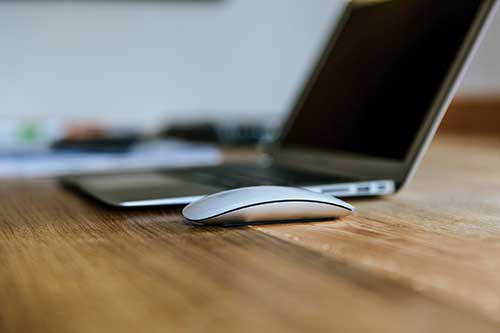 hot-to-pick-a-good-domain-name-for-your-business-clio-websites-mac-on-desk