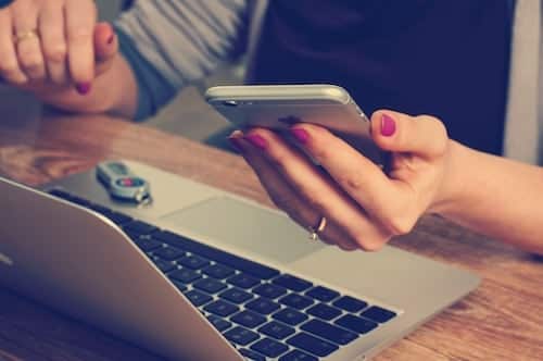 mobile-web-design-woman-using-mobile-clio-websites