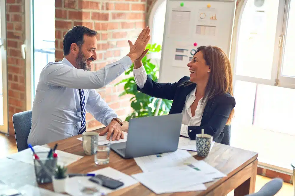 people-high-fiving-in-office-clio-websites