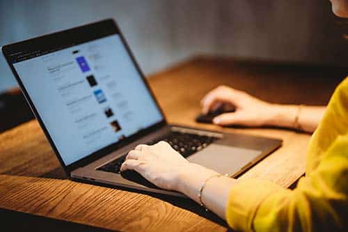 seo-plugins-for-wordpress-clio-websites-woman-on-laptop