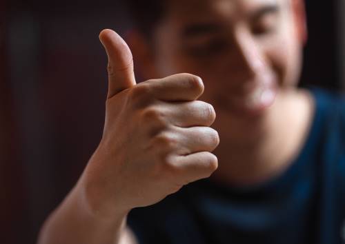 simplify-your-website-design-for-better-user-experience-man-thumbs-up-clio-websites