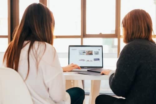 website-maintenance-checklist-women-working-on-computer