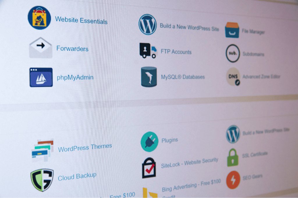 A computer screen displaying a web hosting control panel offers business owners essential tools. Icons highlight services like WordPress site building, email forwarders, phpMyAdmin, FTP accounts, file manager, plugins, cloud backup, and even eCommerce integrations. - Clio Websites | Top Canadian Web Design Company