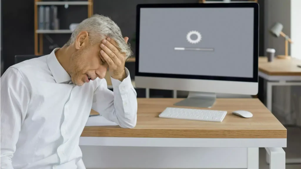 implementing accessibility in web design - frustrated man waiting for screen to load