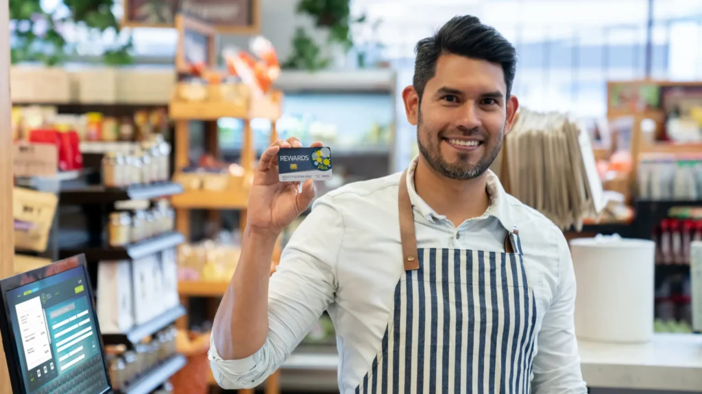man holding rewards card