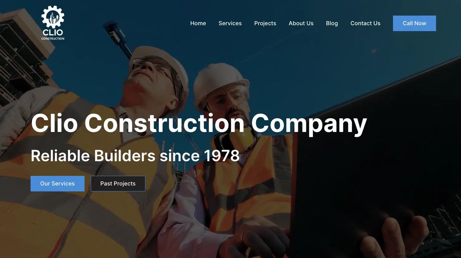 Two construction workers in hard hats and reflective vests review a laptop. The website's theme reads, "Clio Construction Company - Reliable Builders since 1978," featuring navigation links and buttons for exploring services and past projects. - Clio Websites | Top Canadian Web Design Company